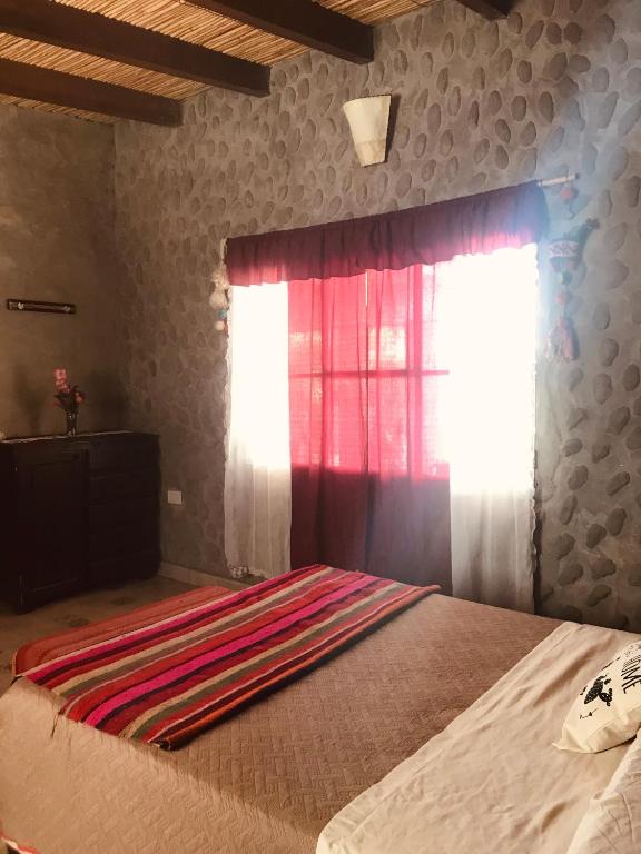 Postel nebo postele na pokoji v ubytování Matices de Molinos Hostal