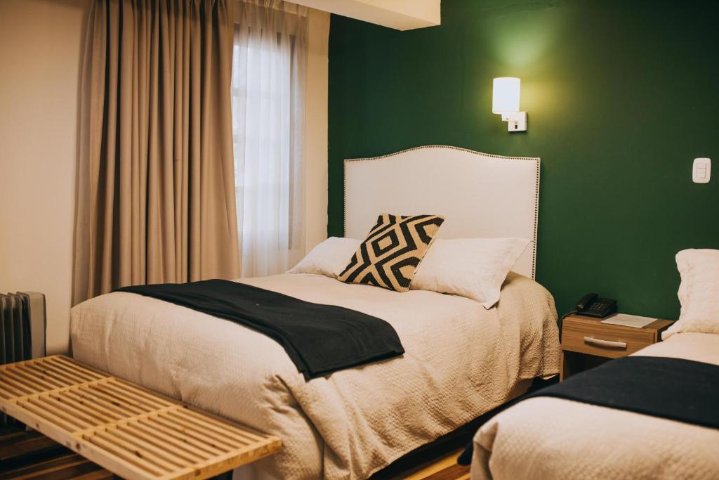 Postel nebo postele na pokoji v ubytování Anden Inca Hotel