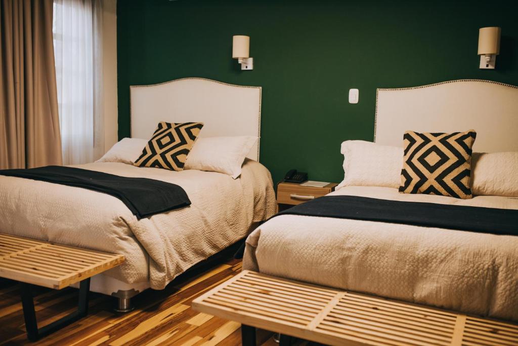Postel nebo postele na pokoji v ubytování Anden Inca Hotel