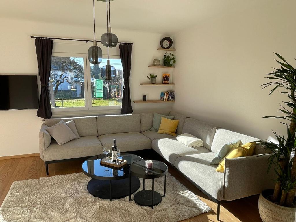 a living room with a couch and a table at Ferienhaus Molitor in Klagenfurt