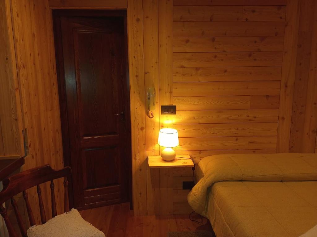 Postel nebo postele na pokoji v ubytování Albergo Martinet