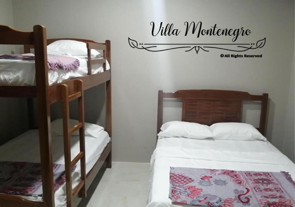 a bedroom with two bunk beds and a sign that readsilla mortgage at Habitación privada en Salinas in Salinas