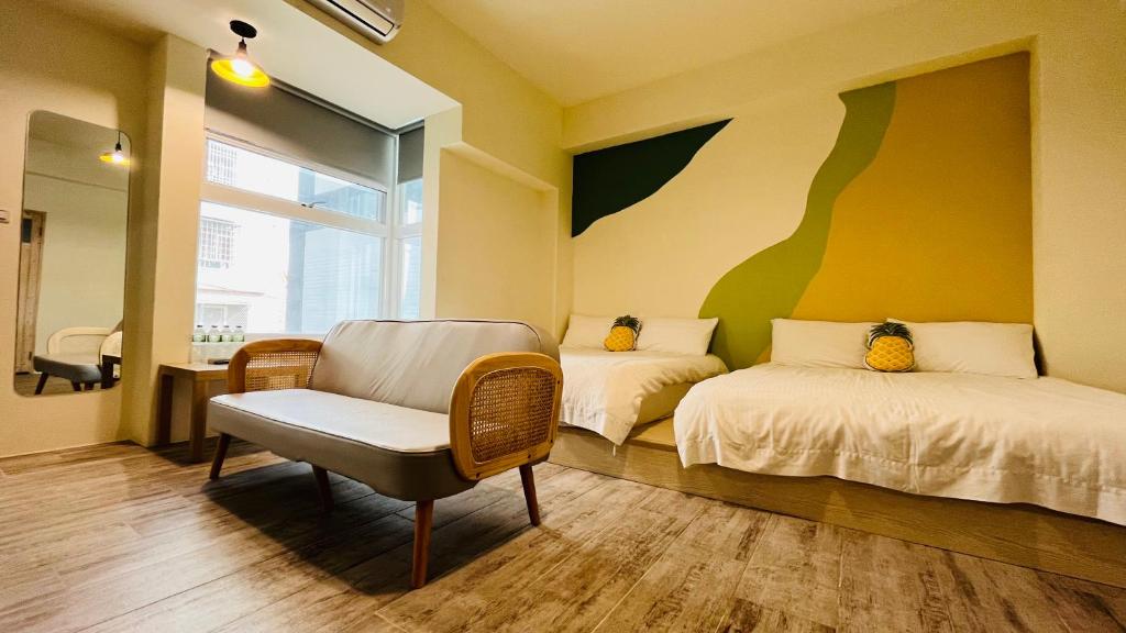 Postel nebo postele na pokoji v ubytování 古栗Chestnut Guest House-可包棟民宿