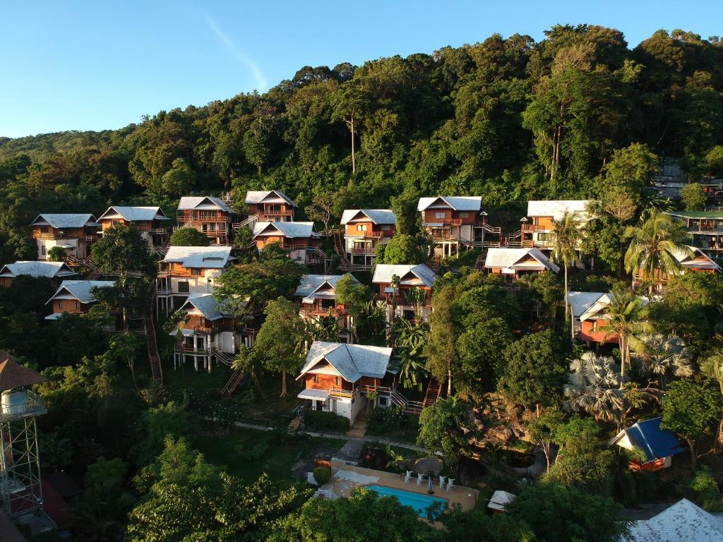 an aerial view of houses in a mountain at Phitharom PP Resort in Phi Phi Islands