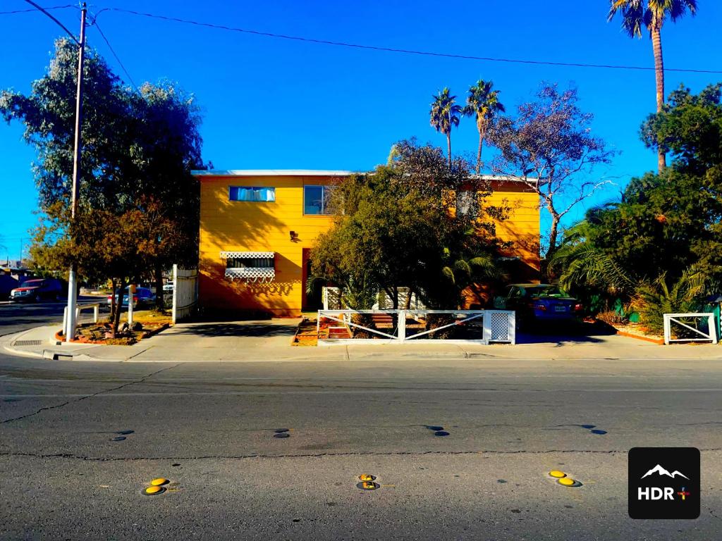 a yellow building on the side of a street at The Yellow Penthouse in Las Vegas