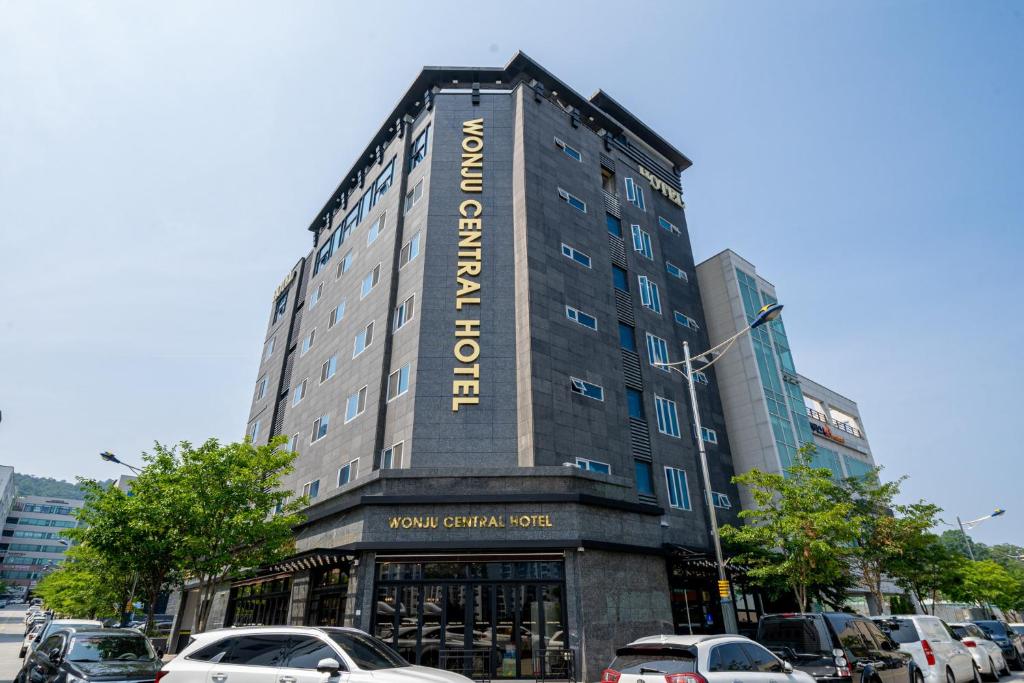 a building with a sign on the side of it at Wonju Central Hotel in Wonju