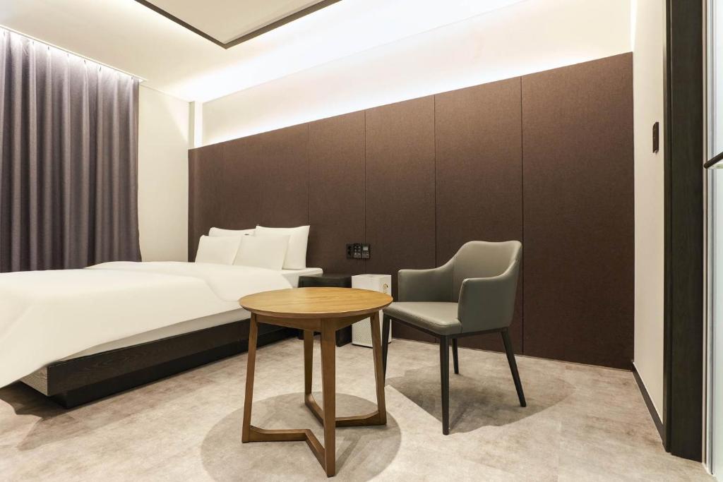 Postel nebo postele na pokoji v ubytování Wonju Central Hotel