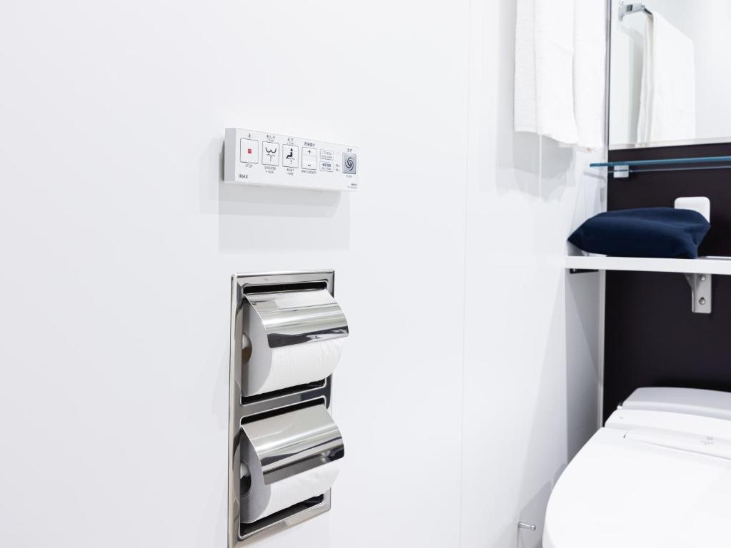 Postel nebo postele na pokoji v ubytování La'gent Hotel Kyoto Nijo