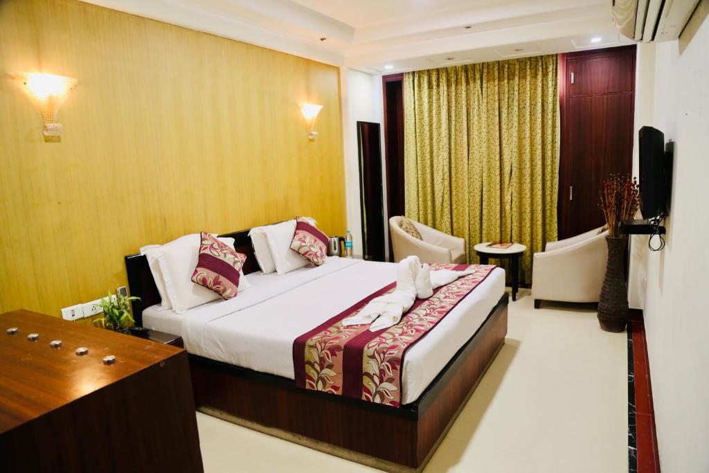 Postel nebo postele na pokoji v ubytování Hotel Bhoomivilas