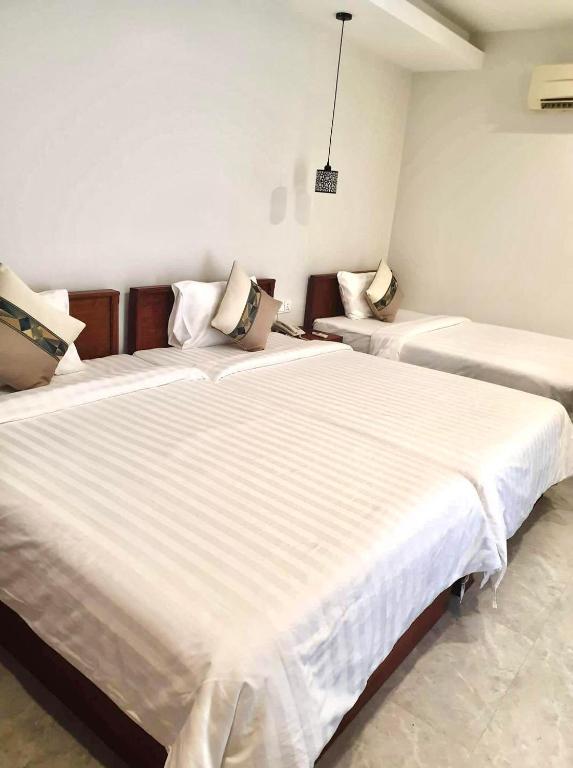 Postel nebo postele na pokoji v ubytování Laluna Guesthouse
