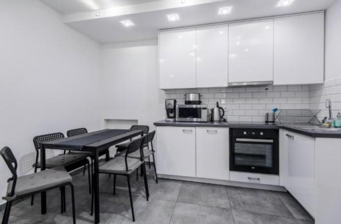 Kuchyňa alebo kuchynka v ubytovaní White Apartment