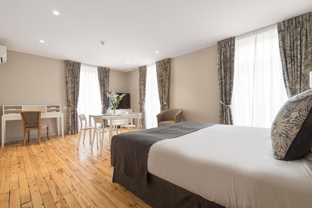 Postel nebo postele na pokoji v ubytování Hôtel Spa Thermalia