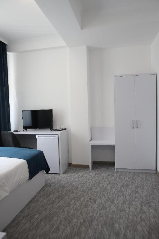 Postel nebo postele na pokoji v ubytování Glass Cube Hotel