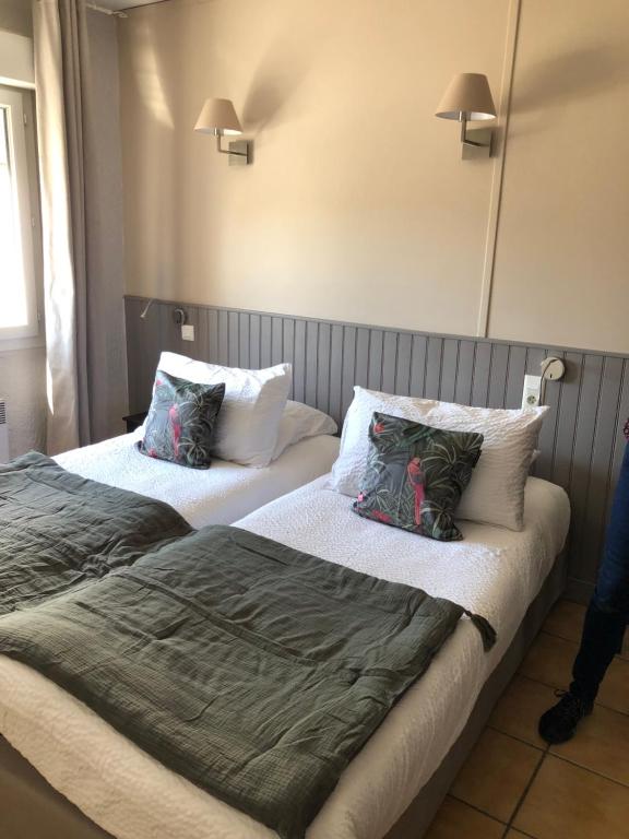 Postel nebo postele na pokoji v ubytování Hôtel Restaurant Le Clos Charmant
