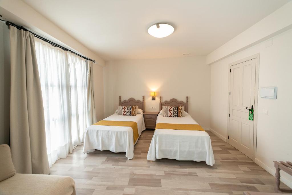 Posteľ alebo postele v izbe v ubytovaní Hotel Casa Palacio la Sal