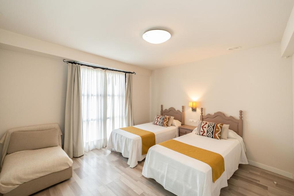 Posteľ alebo postele v izbe v ubytovaní Hotel Casa Palacio la Sal
