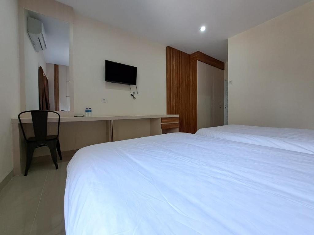 TV o dispositivi per l'intrattenimento presso Pillow Guest House