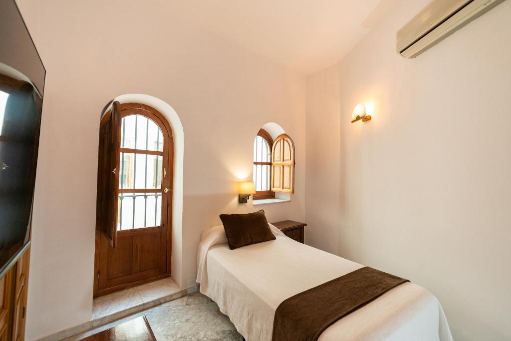 Posteľ alebo postele v izbe v ubytovaní Hotel Casa Palacio la Sal