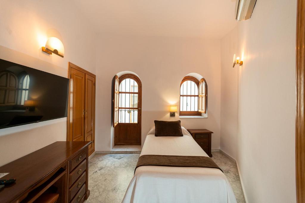 Posteľ alebo postele v izbe v ubytovaní Hotel Casa Palacio la Sal