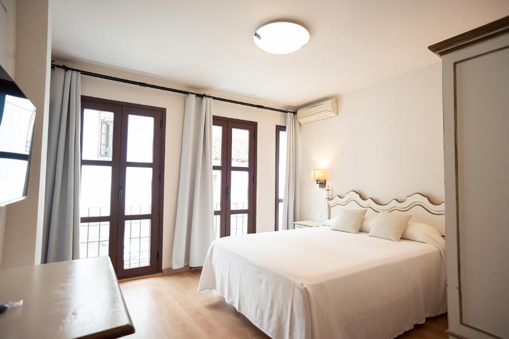 Posteľ alebo postele v izbe v ubytovaní Hotel Casa Palacio la Sal