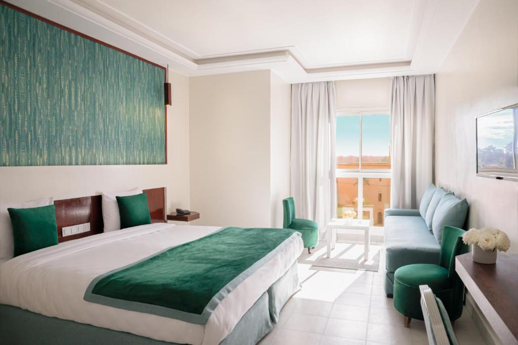 Postel nebo postele na pokoji v ubytování Hotel Safia