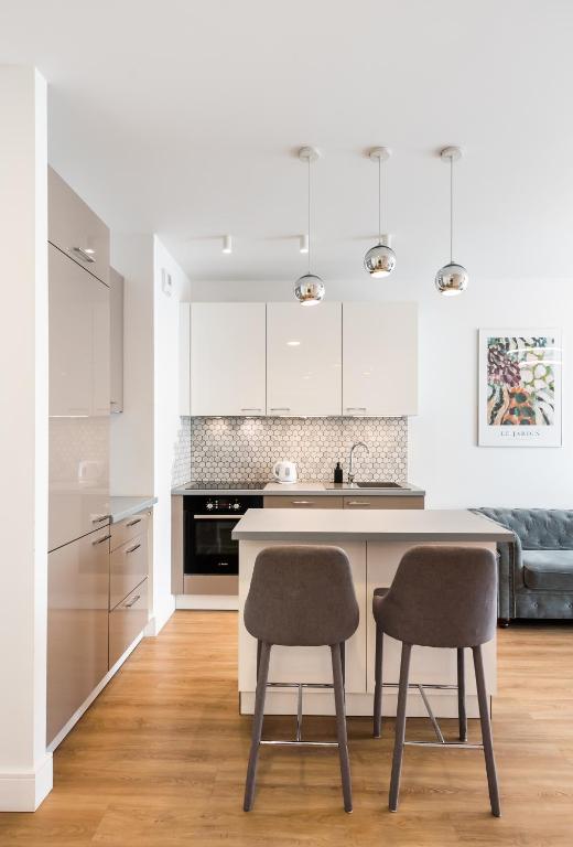 Kuchyňa alebo kuchynka v ubytovaní Wola Bloom Apartment