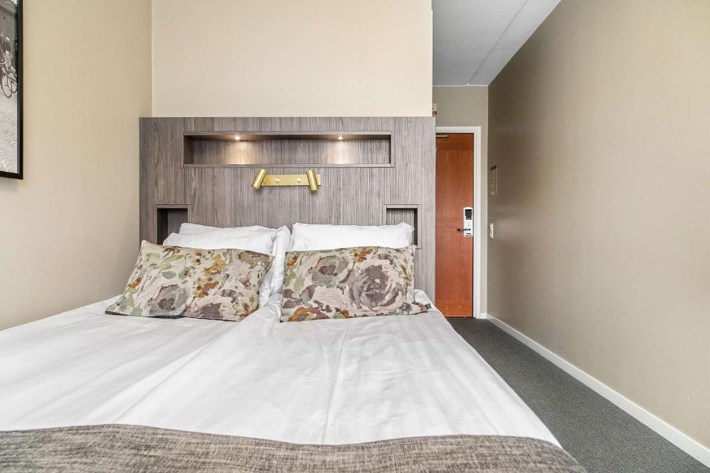 Postel nebo postele na pokoji v ubytování Best Western Ta Inn Hotel