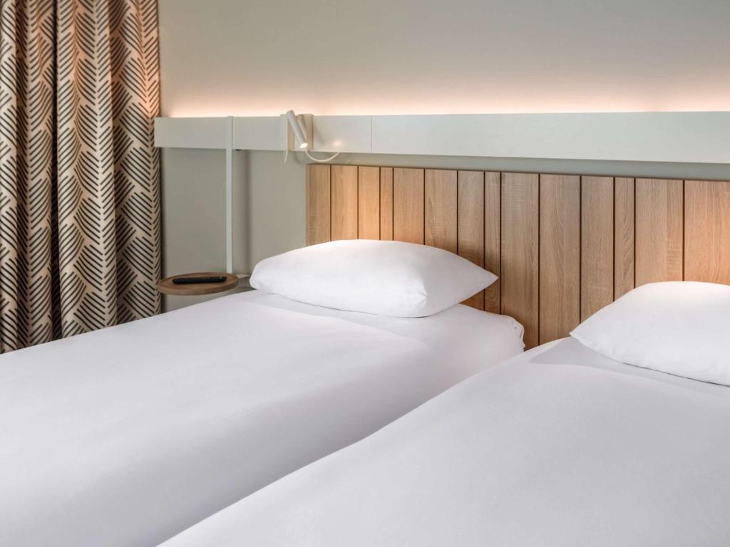 Postel nebo postele na pokoji v ubytování ibis Lyon Est Meyzieu