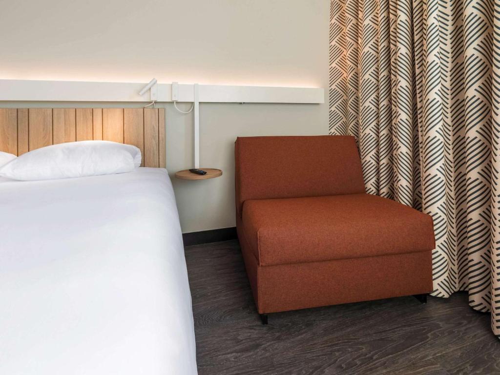 Postel nebo postele na pokoji v ubytování ibis Lyon Est Meyzieu