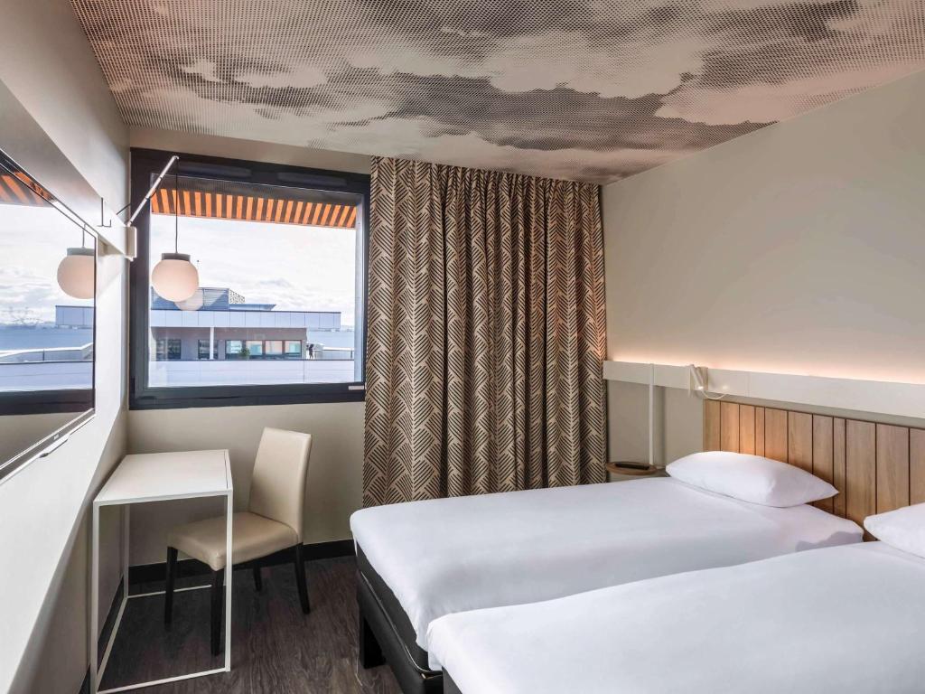 Postel nebo postele na pokoji v ubytování ibis Lyon Est Meyzieu