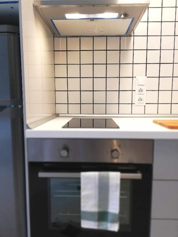 Kuchyň nebo kuchyňský kout v ubytování Mazi Apartments Suite