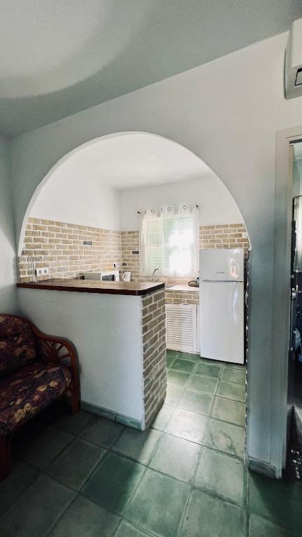 Kuchyň nebo kuchyňský kout v ubytování Ocean Suites