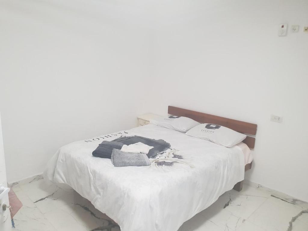 Katil atau katil-katil dalam bilik di Nitra rooms