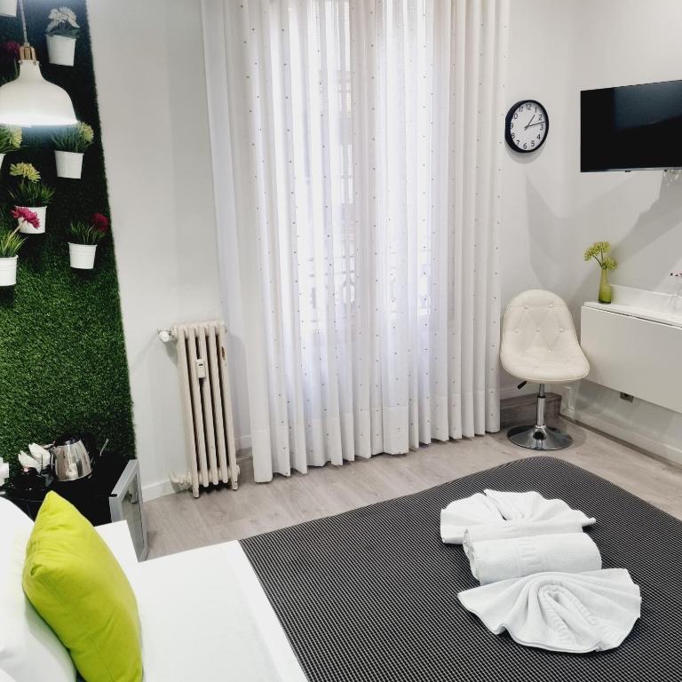 Postel nebo postele na pokoji v ubytování Hostal Lauria