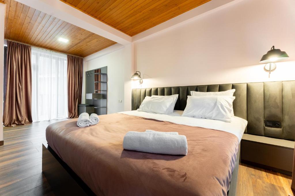 Postel nebo postele na pokoji v ubytování Hotel Mansarda Mestia
