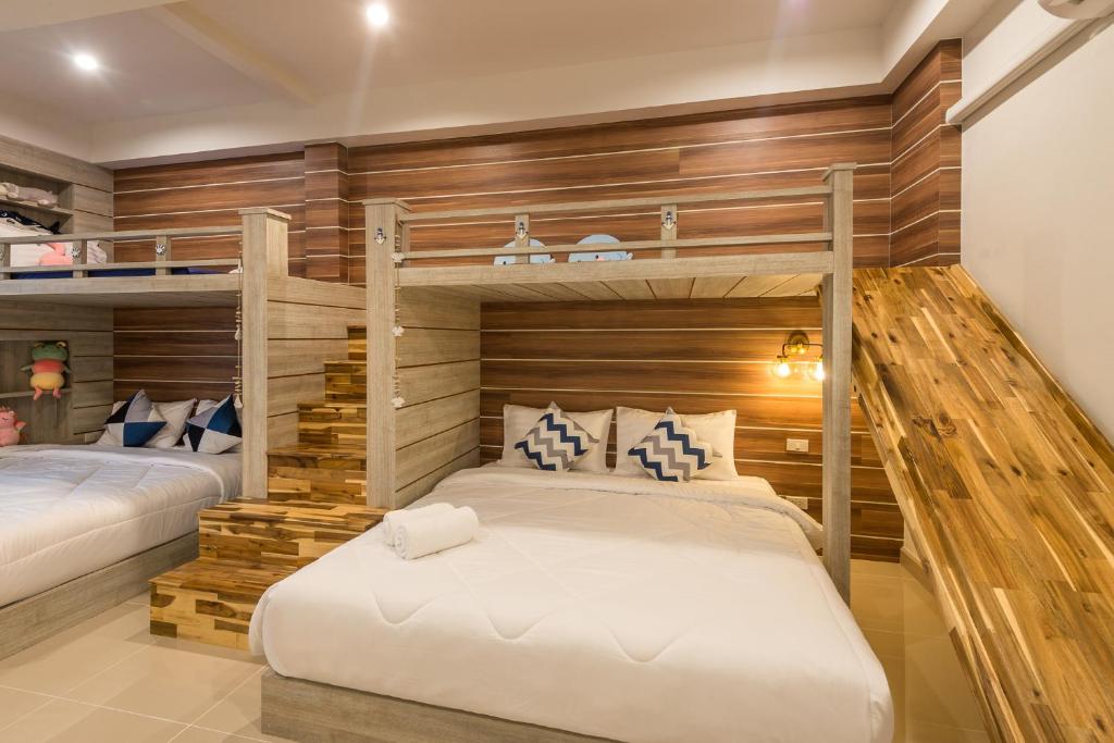 Postel nebo postele na pokoji v ubytování Aonang sealight pool villa