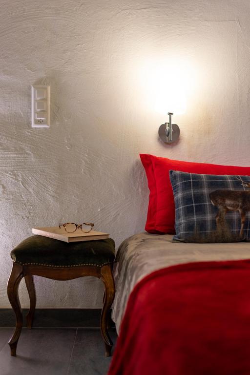 Postel nebo postele na pokoji v ubytování La Petite Grange