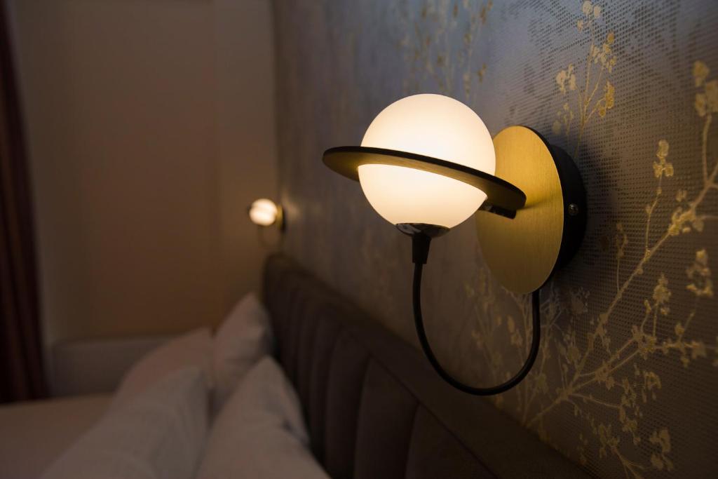 Postel nebo postele na pokoji v ubytování Hotel Mansarda Mestia
