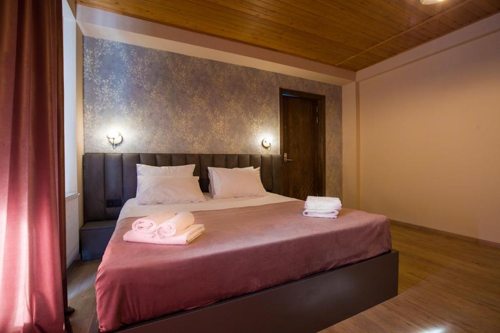 Postel nebo postele na pokoji v ubytování Hotel Mansarda Mestia