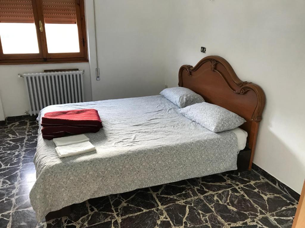 Łóżko lub łóżka w pokoju w obiekcie B&B e Locazioni Turistiche Antico Borgo Toscano