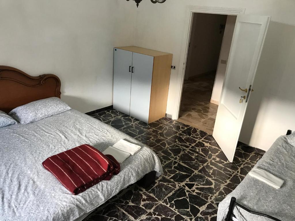 Łóżko lub łóżka w pokoju w obiekcie B&B e Locazioni Turistiche Antico Borgo Toscano