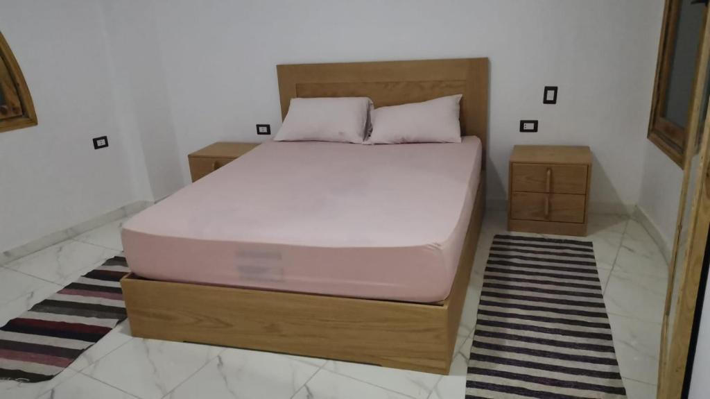 A bed or beds in a room at tala accommodation