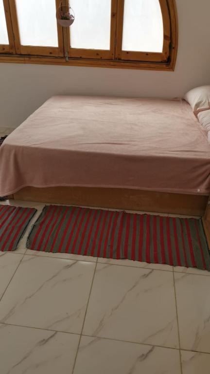 A bed or beds in a room at tala accommodation