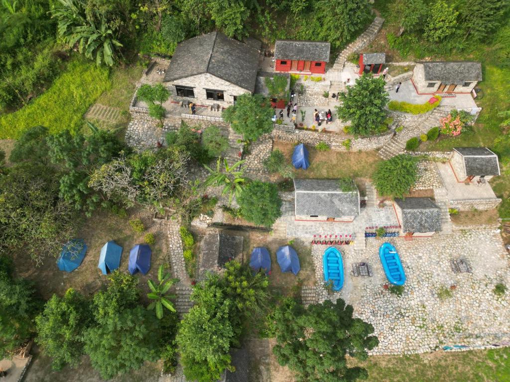 an aerial view of a house with blue roofs at River Edge Resort Nepal in Benighāt