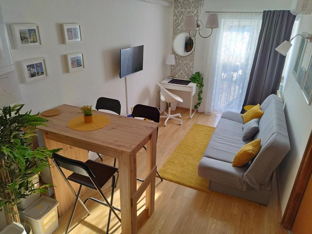 a living room with a couch and a table at Studio Apartment TIM in Zagreb