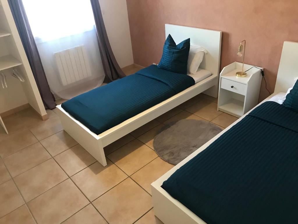 Posteľ alebo postele v izbe v ubytovaní Résidence privée calme 15 min à pied du centre parking gratuit