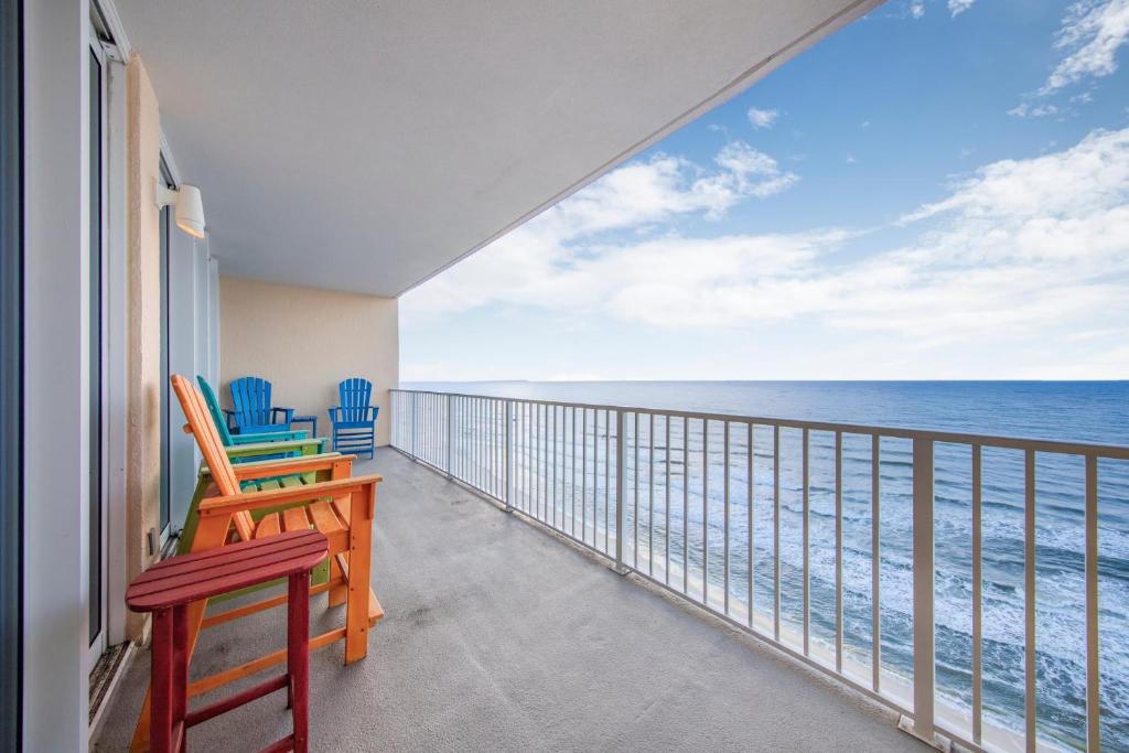 a balcony with chairs and a view of the ocean at San Carlos 1604 by Vacation Homes Collection in Gulf Shores