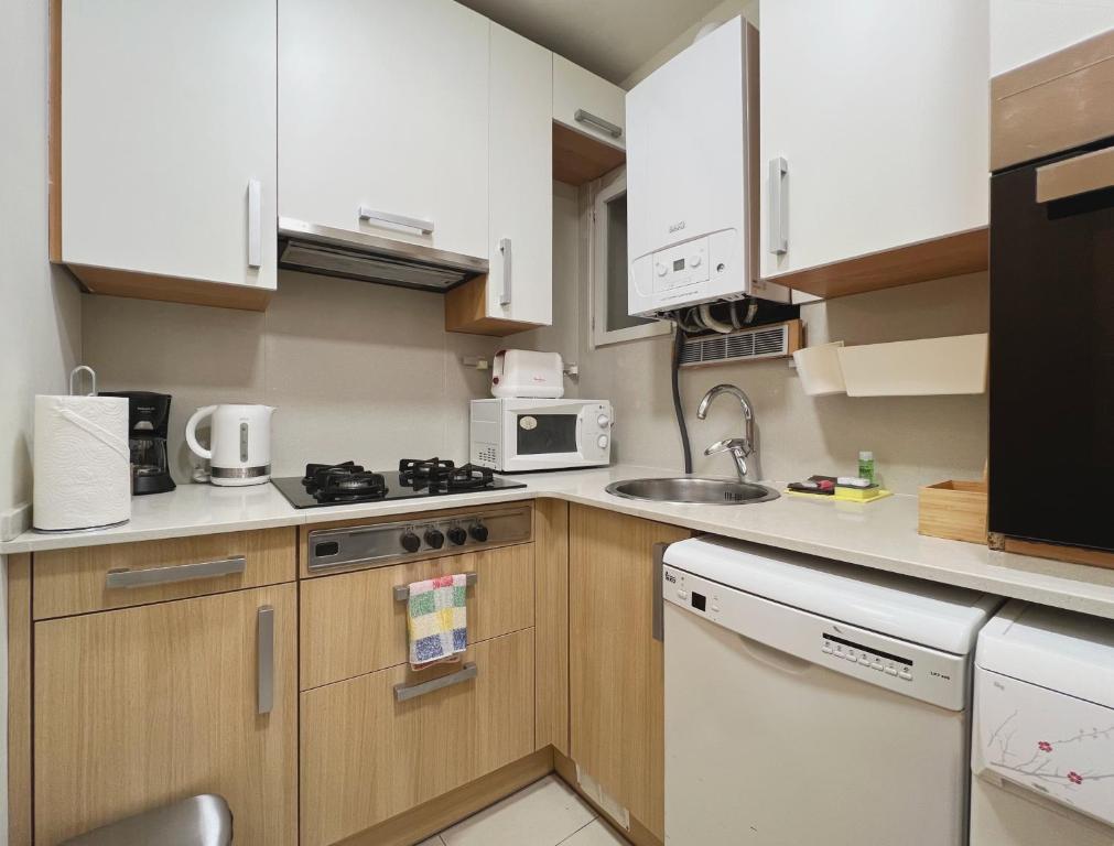 Kuchyň nebo kuchyňský kout v ubytování Stay U-nique Apartments Borbó