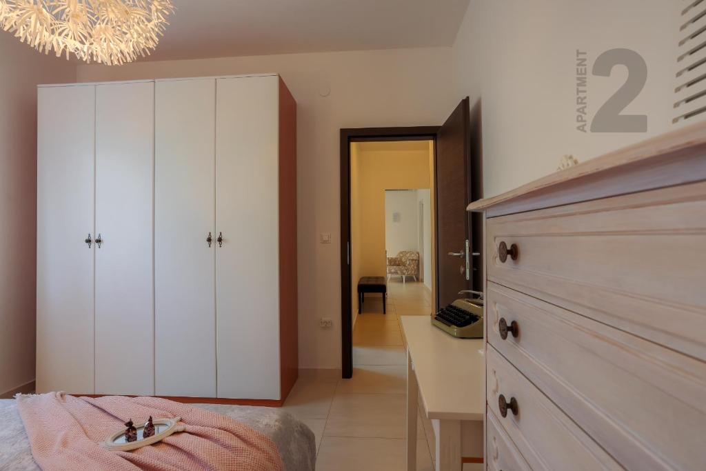 Postel nebo postele na pokoji v ubytování Apartments Kaya