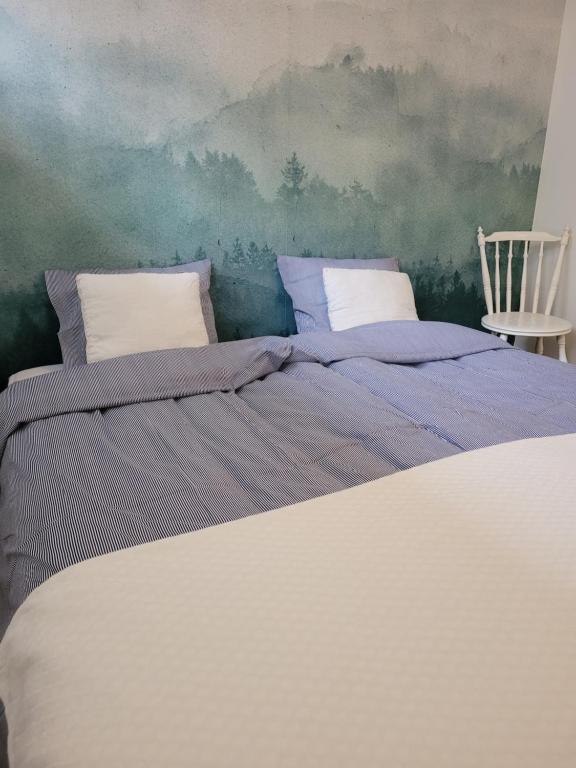 Postel nebo postele na pokoji v ubytování Bokskogens Guesthouse